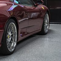 Luxury garage epoxy floor with sports car
